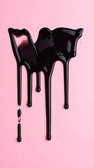 Dripping glossy black substance on a light pink backdrop