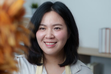 Joyful Moment. Woman smiling while interacting with a friend indoors.