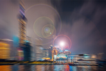 Dynamic urban cityscape at night, featuring blurred architectural wonders with vibrant lights and...