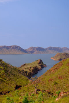 View of Lake Argyle surrounded by green hills