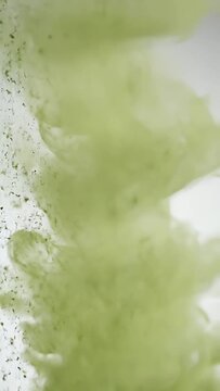 matcha powder dissolving in water abstract motion