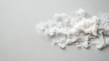 Swirling cloud of white smoke spreads across light gray background, creating abstract and ethereal effect. soft, billowing texture adds sense of movement and fluidity