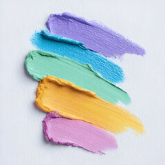 Vibrant, textured paint strokes showcasing a blend of colors on a white canvas for artistic inspiration.