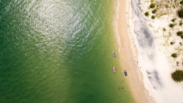 Aerial view of jet skis on water's edge at Bribie Island.