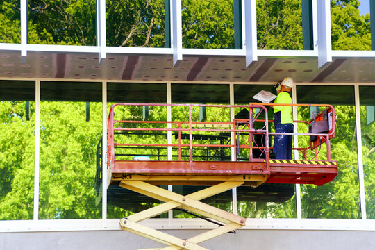 Male tradie on scissor lift.