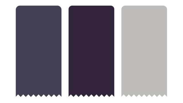 Three monochromatic fabrics with varied hues stand on a dark background surface.