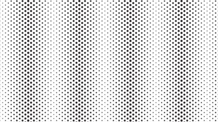 Abstract dark background displaying a halftone pattern of grey dots on black backdrop.