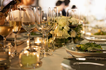 Red and white wine glasses on a beautifully set table, Fine dining and wine, Luxury table setting.