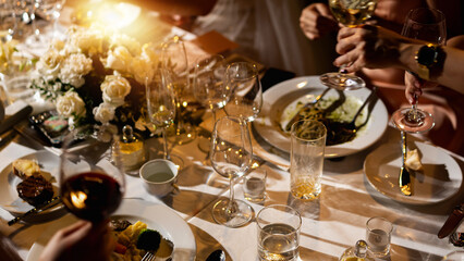 Red and white wine glasses on a beautifully set table, Fine dining and wine, Luxury table setting.