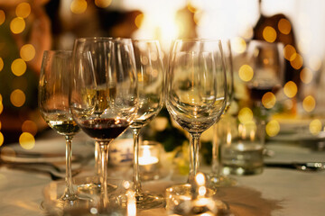 Red and white wine glasses on a beautifully set table, Fine dining and wine, Luxury table setting.