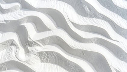 Wavy white sand dunes with light and shadows