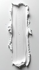 White, textured paint stroke on pale surface