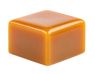Close-up of a single, perfectly square, glossy caramel candy against black