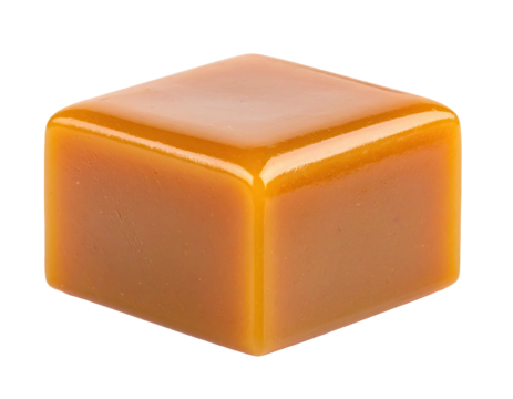 Close-up of a single, perfectly square, glossy caramel candy against black
