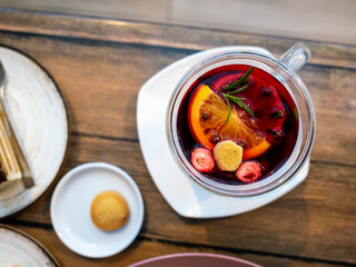 Warm mulled wine with garnishes, Charming glass mug with festive mulled wine