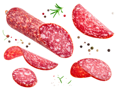 Close-up shot of sliced cured sausage, peppercorns, and herbs on black