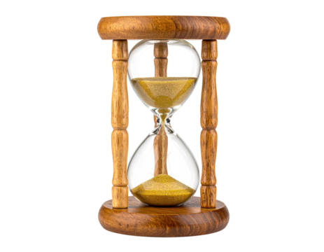Classic wooden hourglass with golden sand flowing inside, isolated on black