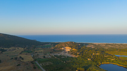 Gelemis, Turkey. Aerial view of Patara Ancient City archaeological site in summer morning, clear sky over ruins and mediterranean landscape. Aerial View