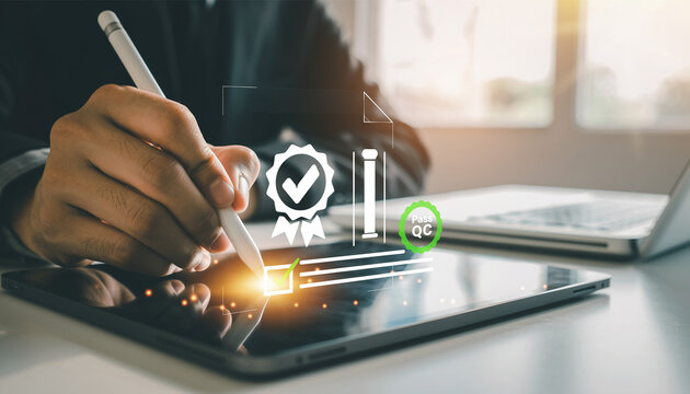 Person using stylus on tablet with digital quality control checkmark and badge.