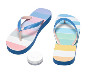 Two colorful flip-flops and a small, white, round object, all on black