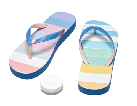 Two colorful flip-flops and a small, white, round object, all on black