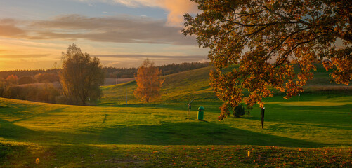 Sunset over a beautiful golf course in autumn