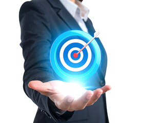 A person in a business suit presents a glowing, digital target with an arrow hitting the bullseye, representing goals