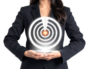 A person in a formal suit holds a glowing target graphic, suggesting focus, achievement, and strategic planning. The background is a stark black