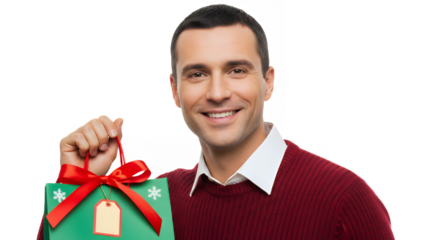 Smiling man holding a christmas gift bag with a red ribbon on transparent background