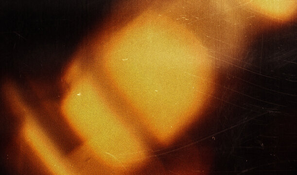 light leak overlay effect with scratch dust and orange light leaks, retro grain noisy film flare on black background, analog old film burn overlay, abstract distressed background
