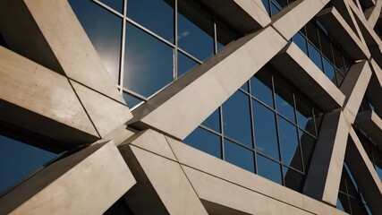 Architectural close-up of geometric patterns on a modern building’s facade, with the sun casting shadows - Powered by Adobe