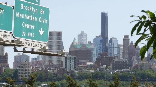 New York City Brooklyn Heights skyline from Manhattan, United States. Residential district near Dumbo and Brooklyn Bridge cityscape. Manhattan Civic Center road traffic sign. FDR Drive urban highway.