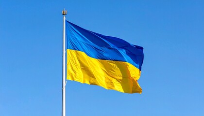 Ukrainian national flag flying against clear blue sky showcasing cultural symbolism and national pride