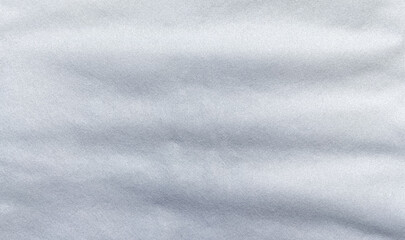 Soft white non-woven fabric texture with fine fibers, suitable for air filter or mask material background, clean textile surface ideal for industrial or medical use.