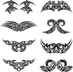 Set of abstract black and white vector tattoo designs with flowing tribal patterns, symmetrical ethnic ornaments, decorative art elements, and graphic illustrations for body or print.