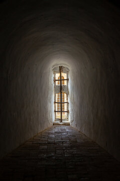 Spotlight of History: Intense Light Beaming Through a Narrow Castle Loophole/Embrasure. Olivenza's Castle.