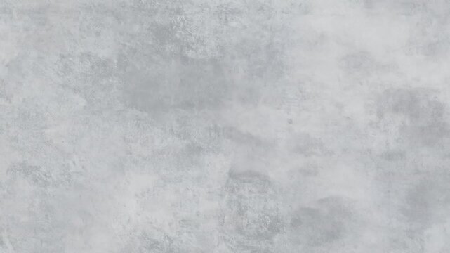 A textured gray surface with a mottled appearance, reminiscent of concrete or aged plaster