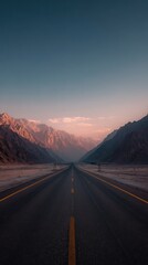 Desert road stretches toward distant mountains, pastel sky above