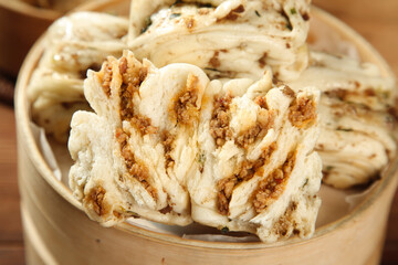 Handmade Spiral Buns with Savory Filling in Bamboo Steamer Basket - Artisanal Bread Rolls