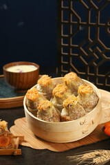 Handmade Cantonese Siu Mai Dumplings with Pearl Topping in Bamboo Steamer - Traditional Chinese Dim Sum Food