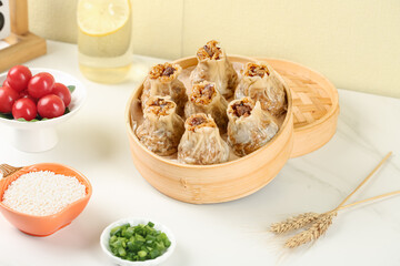 Handmade Siu Mai Dumplings with Glutinous Rice and Pork in Bamboo Steamer - Traditional Chinese Dim Sum
