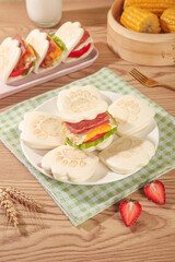 Adorable Bear Paw Shaped Sandwich Buns with Fresh Vegetables and Corn on Wooden Table