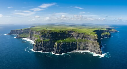 Aerial view of a dramatic coastal landscape with towering cliffs and ocean water