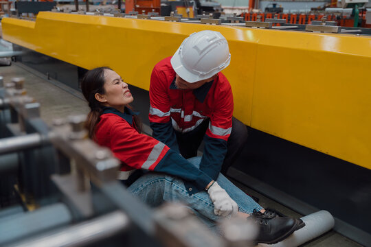 A female worker had an accident that injured her leg in a metal sheet factory.