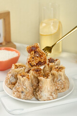 Traditional handmade siu mai dumplings with glutinous rice filling, Chinese dim sum cuisine