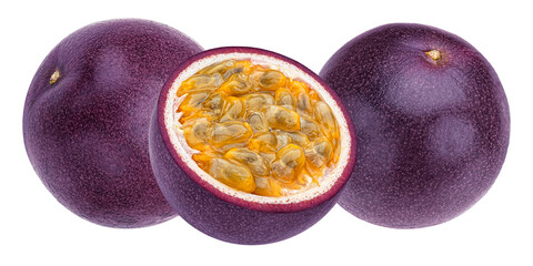 close up photograph of fresh ripe passion fruit, featuring one whole purple fruit and one half showcasing the juicy golden pulp and seeds.