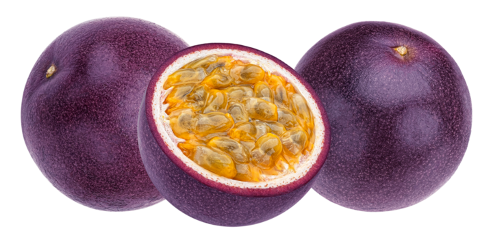 close up photograph of fresh ripe passion fruit, featuring one whole purple fruit and one half showcasing the juicy golden pulp and seeds.