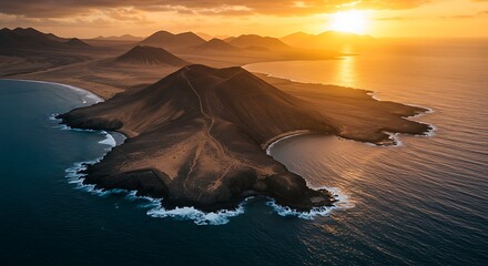 Aerial view of volcanic island, coastlines, and ocean during a vibrant sunset
