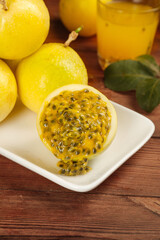 Fresh Golden Passion Fruit with Pulp and Seeds on Wooden Table - Tropical Fujian Fruit