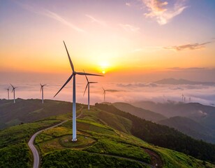 Aerial view of wind turbines on a mountain ridge at sunset, with low clouds